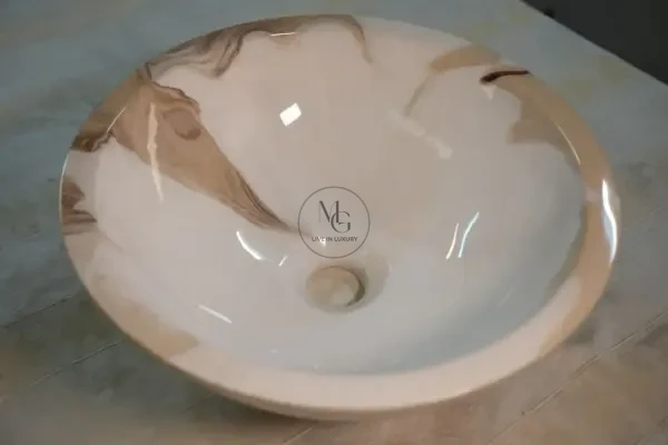 Round Latte artisan washbasin with creamy white and mocha marble swirls and high-shine finish by Majestics Group.