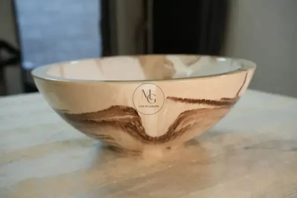 Round Latte artisan washbasin with creamy white and mocha marble swirls and high-shine finish by Majestics Group.