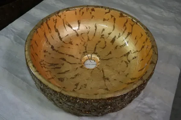 Handcrafted gold leaf marble washbasin with textured glitter exterior from Majestics Group.