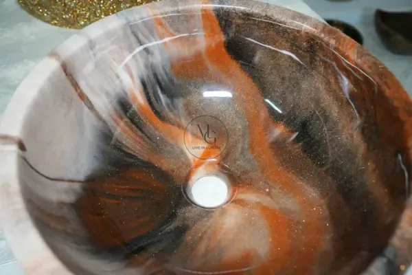 Round Glossy artisan washbasin with orange, white, and black marble swirls and high-shine finish by Majestics Group.