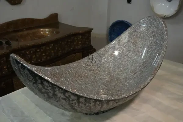 Grand 85cm Pinnache crescent-shaped artisan washbasin with shimmering silver crystal interior and dark textured exterior by Majestics Group.